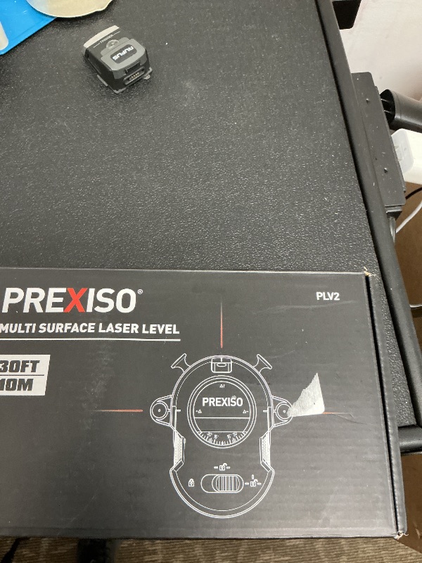 Photo 1 of PREXISO Multi Surface Laser Level LED Light Vial, 30Ft Horizontal & Vertical Line Laser with Wall Mount Base, 2 Pins, 10 Sticker, 2 AA Batteries for Hanging Frames & Picture, Construction Wall Writing