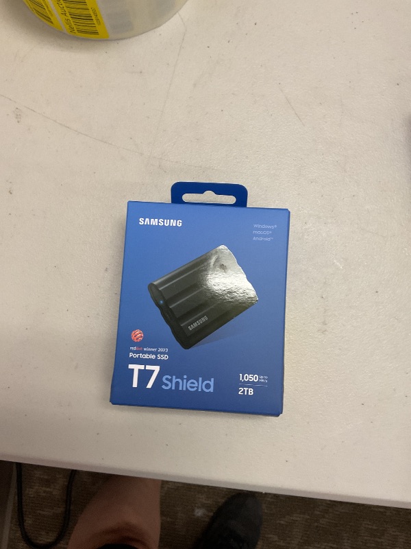 Photo 1 of Samsung T7 Shield 2TB, Portable SSD, up-to 1050MB/s, USB 3.2 Gen2, Rugged,IP65 Water & Dust Resistant, for Photographers, Content Creators and Gaming, Extenal Solid State Drive (MU-PE2T0S/AM), Black