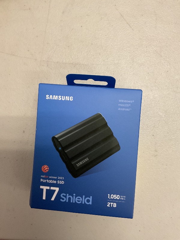 Photo 1 of Samsung T7 Shield 2TB, Portable SSD, up-to 1050MB/s, USB 3.2 Gen2, Rugged,IP65 Water & Dust Resistant, for Photographers, Content Creators and Gaming, Extenal Solid State Drive (MU-PE2T0S/AM), Black