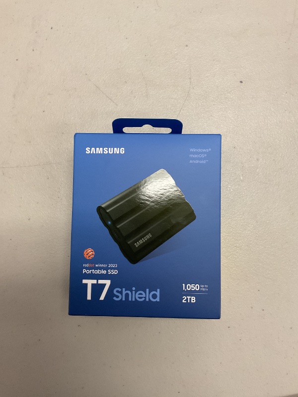 Photo 1 of Samsung T7 Shield 2TB, Portable SSD, up-to 1050MB/s, USB 3.2 Gen2, Rugged,IP65 Water & Dust Resistant, for Photographers, Content Creators and Gaming, Extenal Solid State Drive (MU-PE2T0S/AM), Black