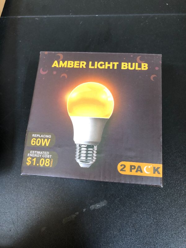 Photo 1 of DALUXshop Amber Sleep Light Bulbs, Blue Light Blocking, A19 9W(60 Watt Equivalent) Dim Light Bulbs for Lamp, 1800K Warm Light Bulb, E26 for Healthy Sleep, Bedroom, Kids Room, 2 Pack