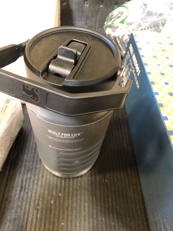 Photo 1 of Stanley IceFlow Flip Straw Jug with Handle 64 oz| Twist On Lid and Flip Up Straw | Leak Resistant for Travel and Sports | Insulated Stainless Steel |BPA-Free |Charcoal