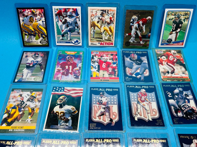 Photo 1 of 165058… mixed football cards in hard plastic sleeves 
