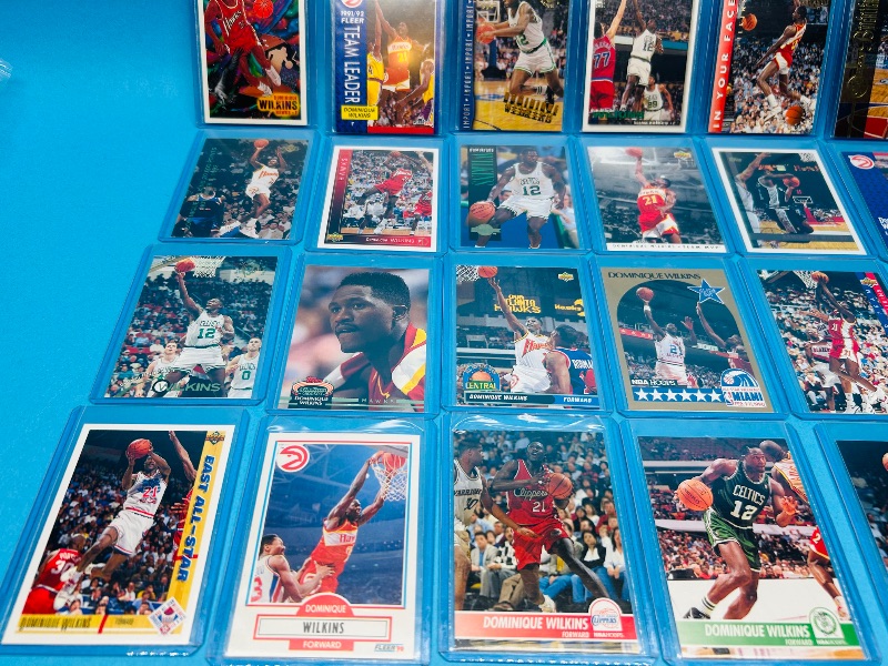 Photo 1 of 165061… mixed Dominique Wilkins basketball cards in hard plastic sleeves 