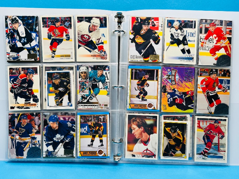 Photo 1 of 165119… final sale no returns/refunds-270 mixed hockey cards in binder