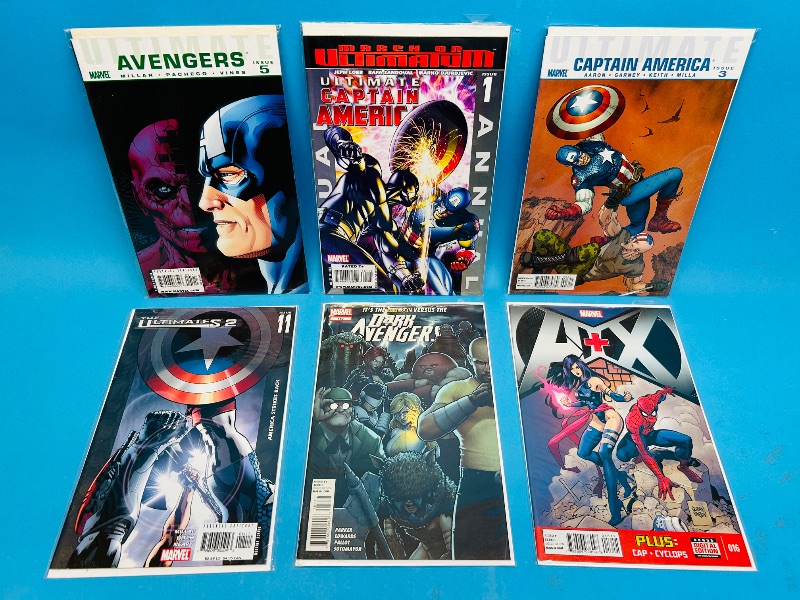 Photo 1 of 165145…6  comics in plastic sleeves 