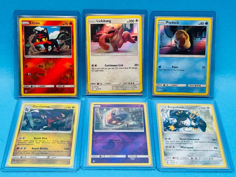 Photo 1 of 165304… 6 holo and reverse holo Pokémon cards in hard plastic sleeves