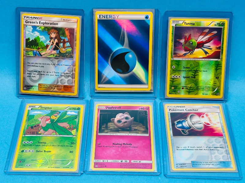 Photo 1 of 165305… 6 holo and reverse holo Pokémon cards in hard plastic sleeves