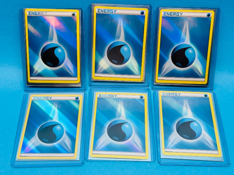 Photo 1 of 165306… 6 holo energy Pokémon cards in hard plastic sleeves 