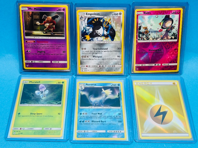 Photo 1 of 165307… 6 holo and reverse holo Pokémon cards in hard plastic sleeves