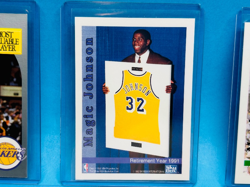 Photo 1 of 165333…5 Magic Johnson cards in hard plastic sleeves 
