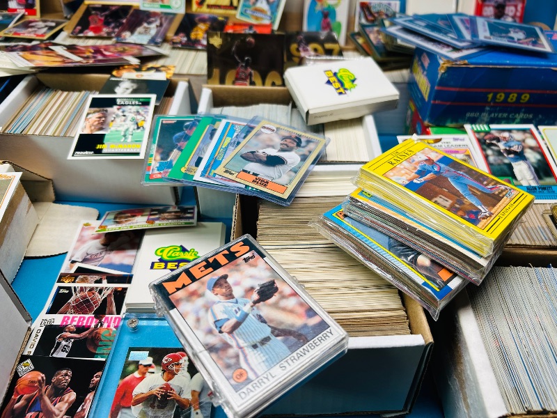 Photo 1 of 165348…final sale no returns/refunds- thousands of mixed sports cards- sets may not be complete. Older cards may have wear from age.-baseball, football, hockey, and basketball 