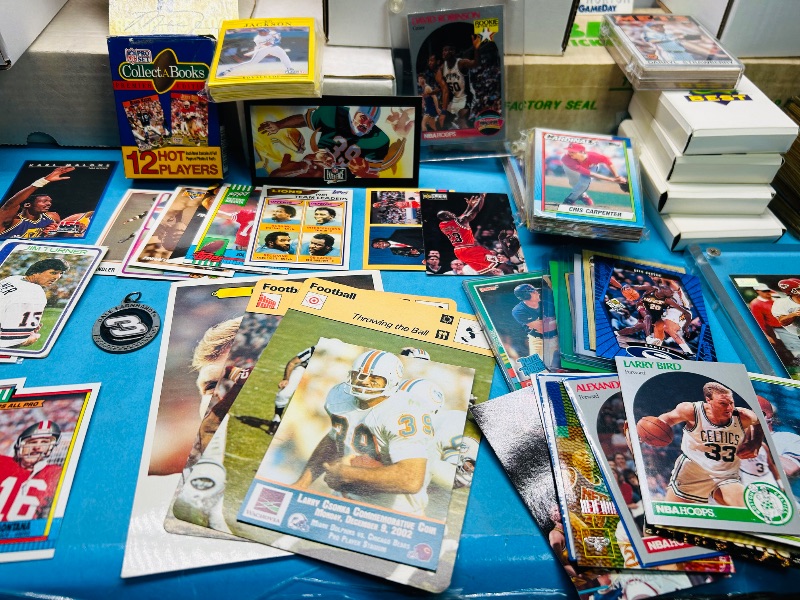 Photo 1 of 165348…final sale no returns/refunds- thousands of mixed sports cards- sets may not be complete. Older cards may have wear from age.-baseball, football, hockey, and basketball 
