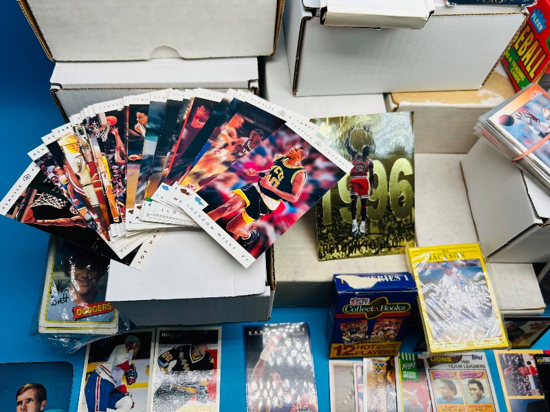 Photo 1 of 165348…final sale no returns/refunds- thousands of mixed sports cards- sets may not be complete. Older cards may have wear from age.-baseball, football, hockey, and basketball 