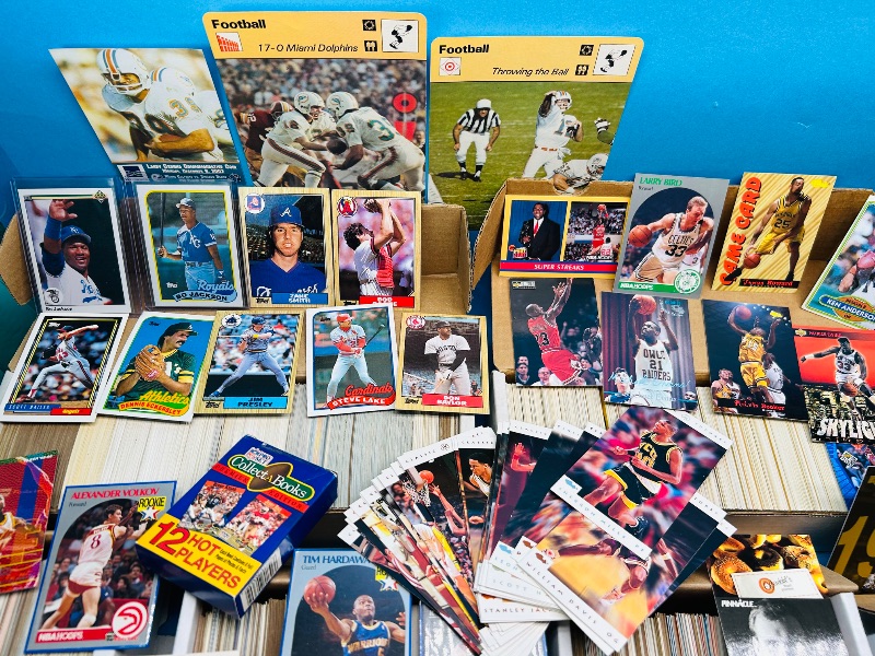 Photo 1 of 165348…final sale no returns/refunds- thousands of mixed sports cards- sets may not be complete. Older cards may have wear from age.-baseball, football, hockey, and basketball 