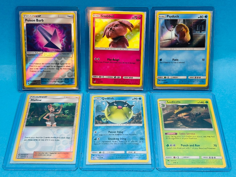 Photo 1 of 165413…6 holo and reverse Pokémon cards in hard plastic sleeves 