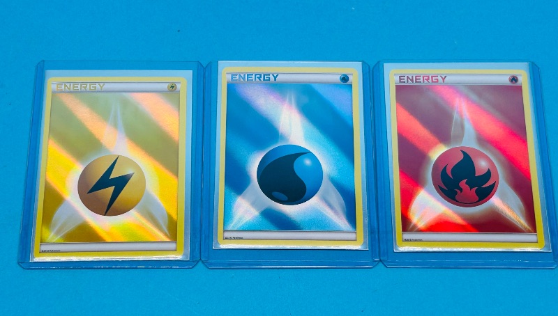 Photo 1 of 165419…3 hologram Pokémon energy cards in hard plastic sleeves 