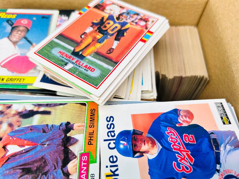 Photo 1 of 165447… final sale no returns/refunds- damaged mixed sports cards in 10 x 5 x 7” box- bent, worn, stains, etc.