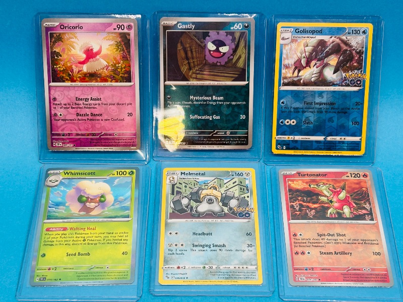 Photo 1 of 165137…6 reverse and holo Pokémon cards in hard plastic sleeves 