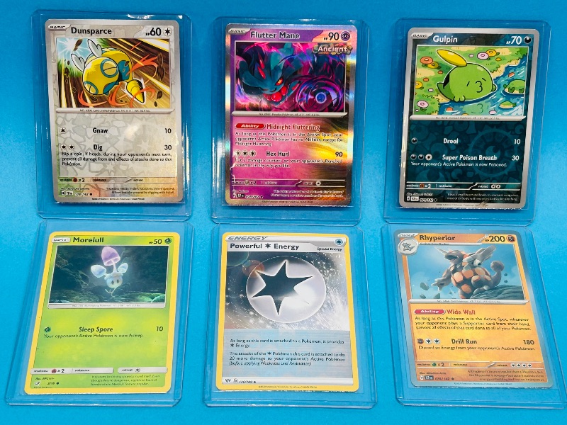 Photo 1 of 165538… 6 reverse and holo Pokémon cards in hard plastic sleeves 
