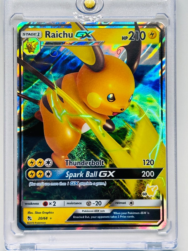 Photo 1 of 165631…holo Raichu GX Pokémon card in hard plastic case