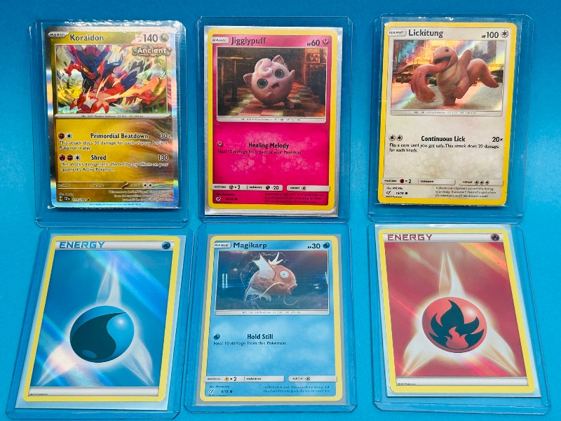 Photo 1 of 165642… 6 holo Pokémon card in hard plastic sleeves 