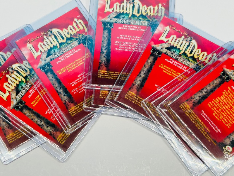 Photo 1 of 165706…8 chromium Lady Death cards in hard plastic sleeves