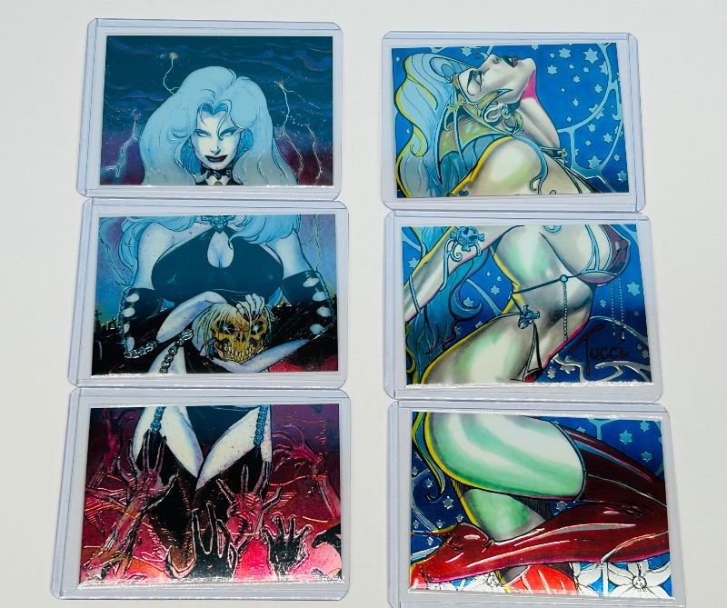 Photo 1 of 165709…6 chromium Lady Death cards in hard plastic sleeves