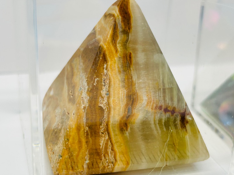 Photo 1 of 165711…small onyx and acrylic pyramids in display cases 
