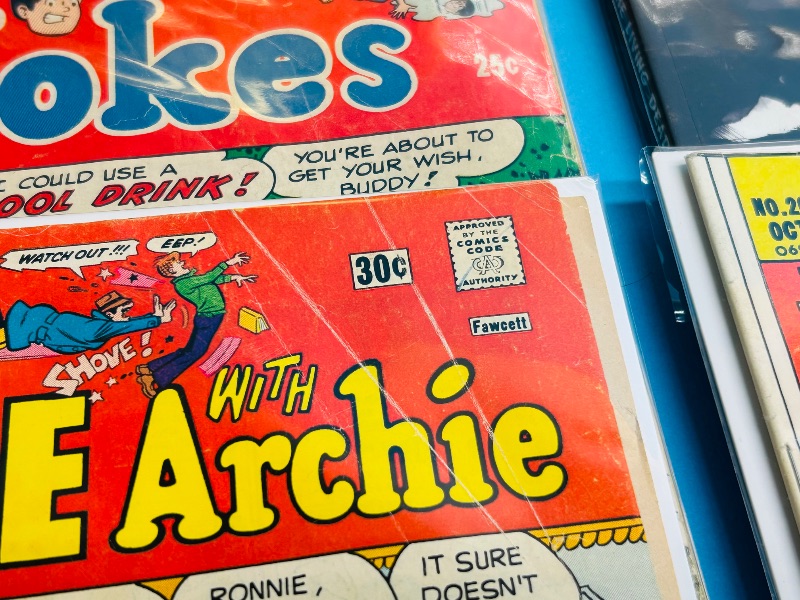 Photo 1 of 165730… damaged- 15 comics with bends, rips, stains, wear from age- final sale no return/refund