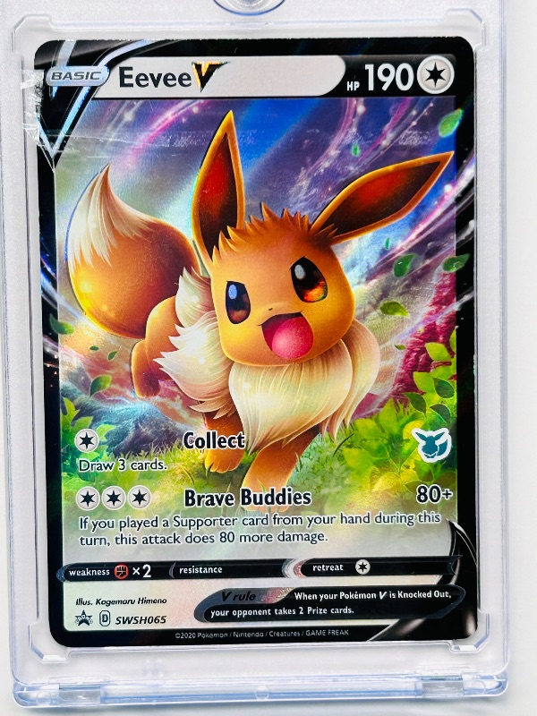 Photo 1 of 165758…Hologram Eevee V Pokémon card in hard plastic case