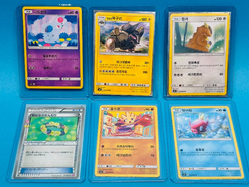 Photo 1 of 165762…6 Asian Pokemon cards in hard plastic sleeves