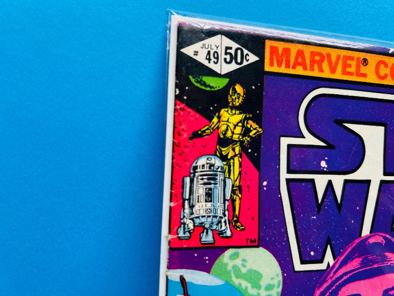 Photo 1 of 165800… vintage Star Wars comic 49 in plastic sleeve - wear from age
