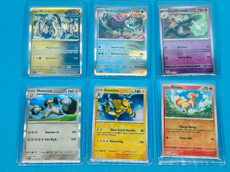 Photo 1 of 165901… 6 reverse/holo Pokémon cards in hard plastic sleeves