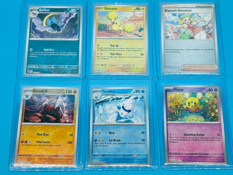 Photo 1 of 165903… 6 reverse/holo Pokémon cards  in hard plastic sleeves 