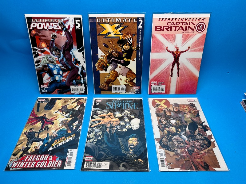 Photo 1 of 166098…6  comics in plastic sleeves 