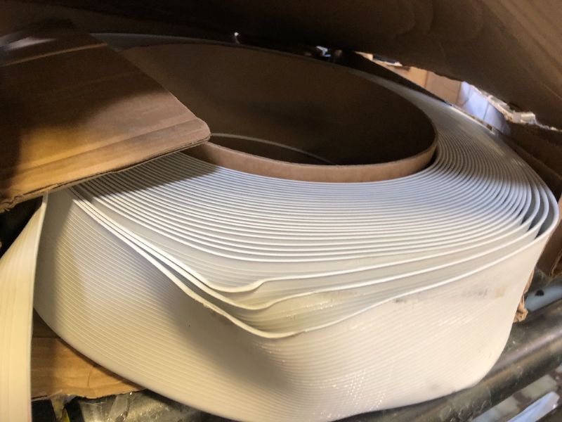 Photo 1 of Mohawk Vinyl Cove Wall Base Molding Trim in White 4”W x 120’ L roll; one roll per Carton