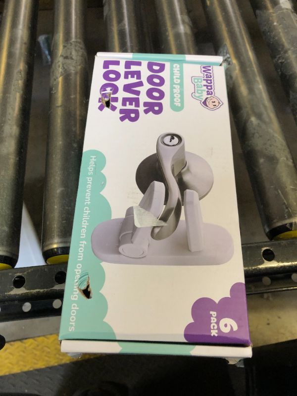 Photo 1 of Door Lever Lock (6 Pack) Prevents Toddlers from Opening Doors. 3.25" L * 1.5" W * 4.5" H Easy One Hand Operation for Adults. Durable ABS with 3M Adhesive Backing. Simple Install, No Tools Needed.