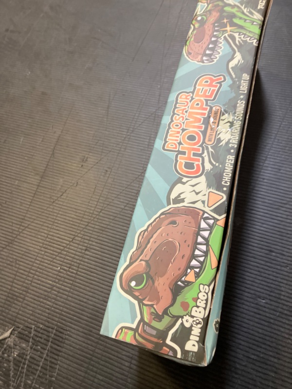 Photo 1 of DINOBROS Dinosaur Chomper Toys for Kids with 3 Roar Sounds and Light Jurassic Dinosaurs Grabber Claw T-Rex Reacher Robot Hand Pincher Dino Snapper