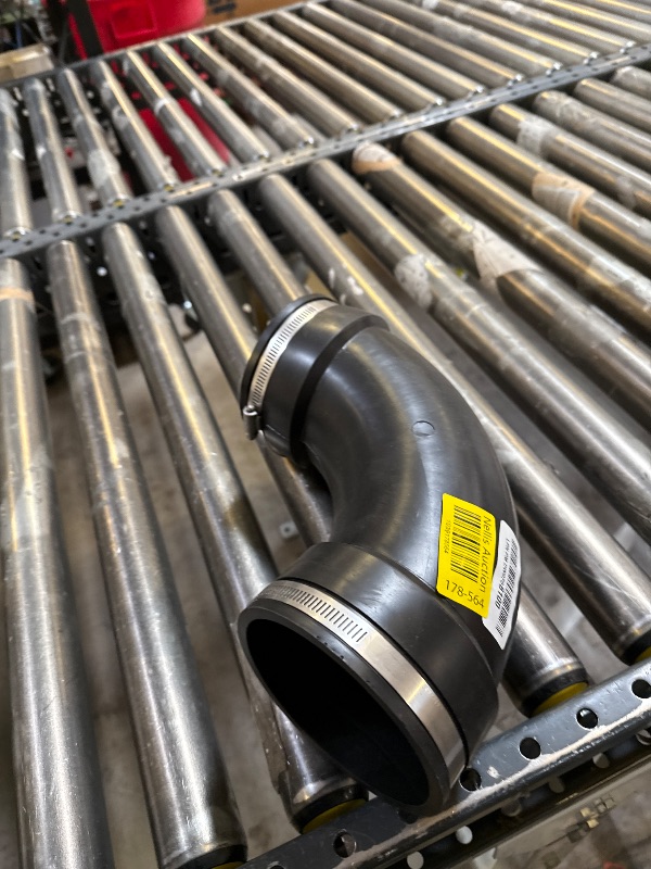 Photo 1 of Fernco 4" Flexible PVC 90-Degree Elbow Includes Optional 3" Reducer Bushing for DWV Cast Iron, Steel and Plastic Pipe Connections
