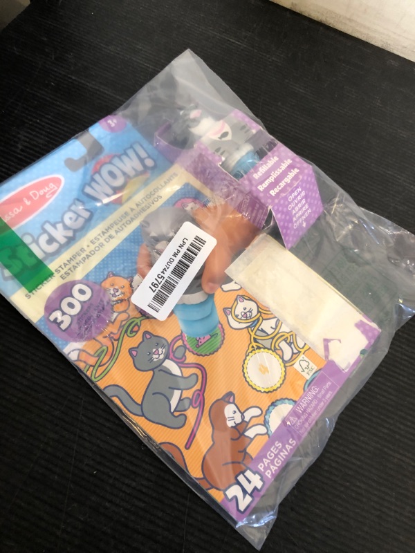 Photo 1 of Melissa & Doug Sticker WOW!™ 24-Page Activity Pad and Sticker Stamper, 300 Stickers, Arts and Crafts Fidget Toy Collectible Character – Cat - FSC Certified