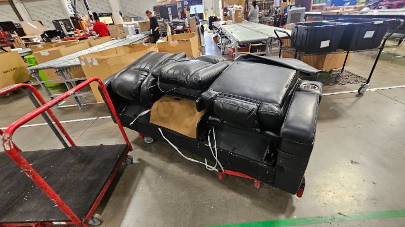 Photo 1 of ***TRUCK OR TRAILER PICK UP****BROKEN DAMAGED******PARTIAL SET****Signature Design by Ashley Caveman Den Modern Faux Leather Power Reclining Sofa with Adjustable Headrest, Drop Down Table, Electrical Outlets and LED Reading Lights, Black
