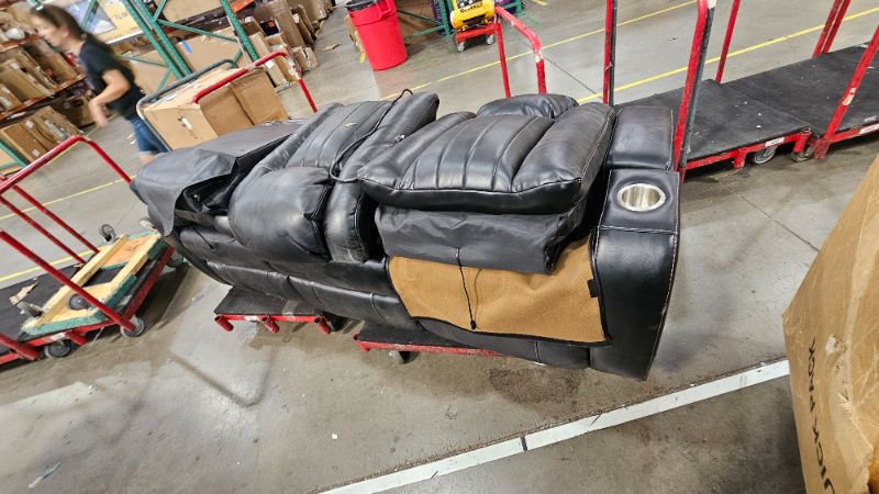 Photo 1 of ***TRUCK OR TRAILER PICK UP****BROKEN DAMAGED******PARTIAL SET****Signature Design by Ashley Caveman Den Modern Faux Leather Power Reclining Sofa with Adjustable Headrest, Drop Down Table, Electrical Outlets and LED Reading Lights, Black