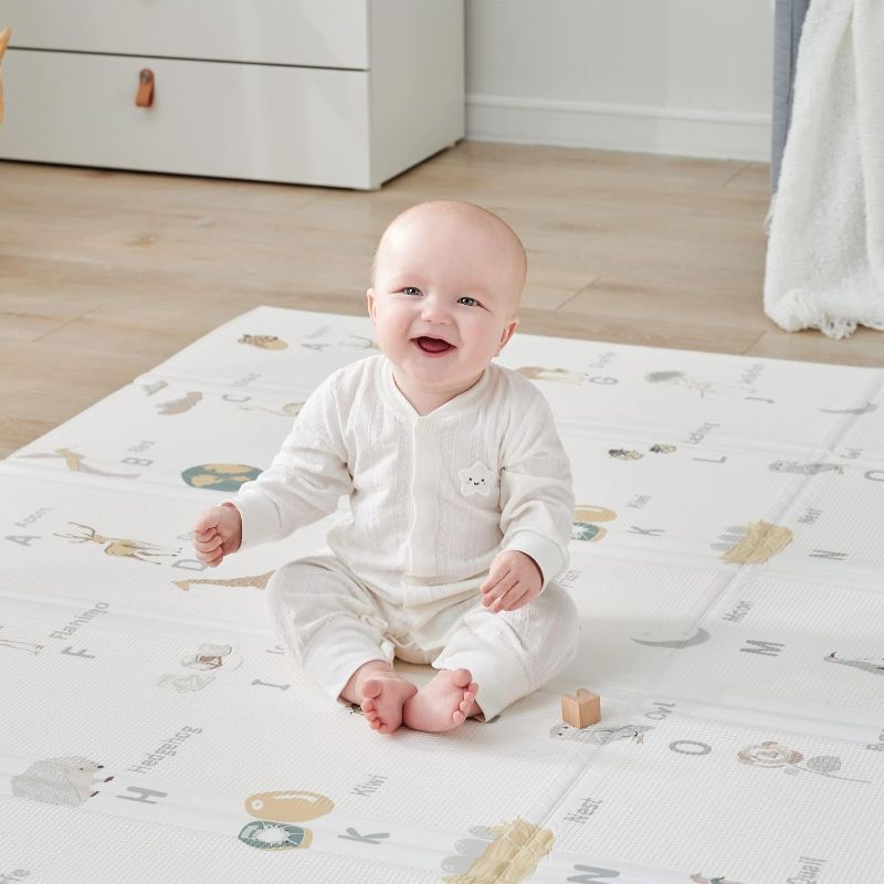 Photo 1 of (STYLE VARYS) Cuddle & Learn Playmat by Fortella, Foldable Foam Baby Play Mat for Floor, Extra Large & Padded for Tummy Time and Outdoors, Portable with Travel Case 