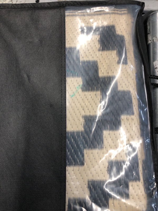 Photo 1 of (USED/FAIR) Smiry Waterproof Outdoor Rug 5x8 ft, Reversible Plastic Straw Patio Camping Rugs, Outdoor Indoor RV Mat Carpet for Patio, Outside Entry, Backyard, Deck, Bench, Picnic, Camper, Black & Beige