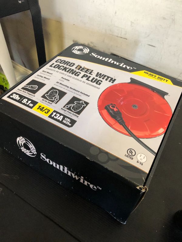 Photo 1 of Woods Medium Duty Extension Cord Reel with Locking Plug, 30Ft, 14 Gauge, 3 Conductor, Metal Reel, Red, 48004