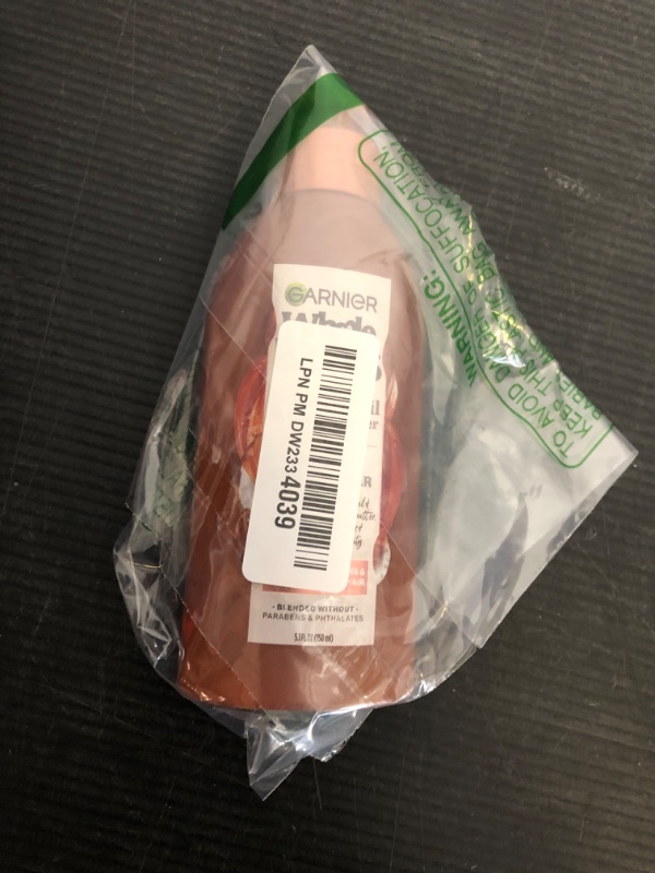 Photo 1 of Garnier Whole Blends Coconut Oil & Cocoa Butter Smoothing Leave in Conditioner for Frizzy Hair, 5.1 Fl Oz, 1 Count (Packaging May Vary)