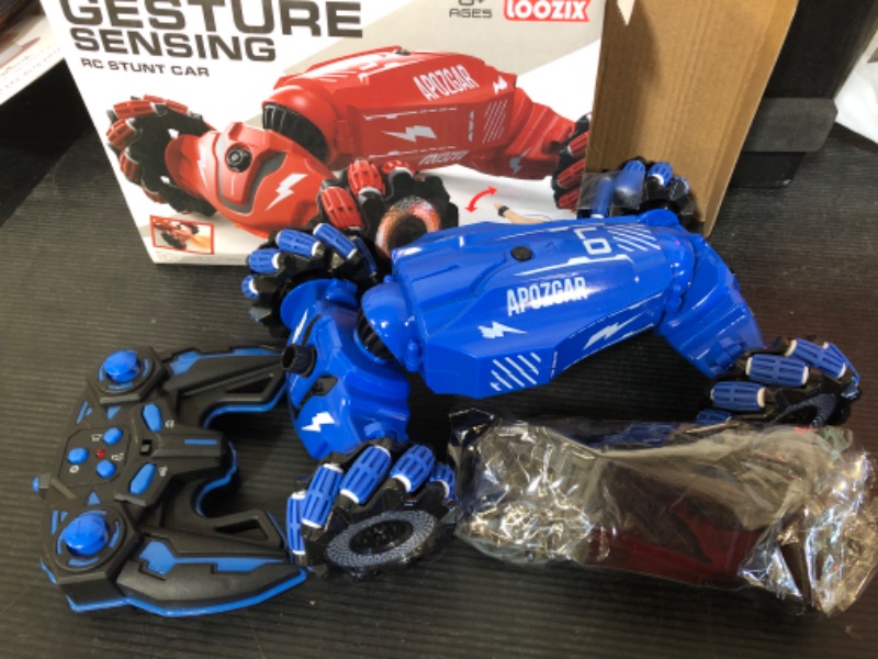 Photo 1 of LOOZIX Upgraded Hand Gesture Sensing RC Stunt Car with Lights Music, Spray Drift Gesture RC Car 360° Spins All Terrains Hand Controlled Truck Toys for 6 7 8 9 10 Year Old Boys