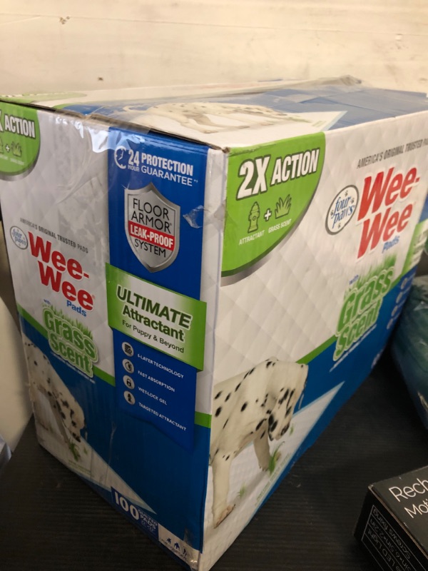Photo 1 of Four Paws Wee-Wee Ultimate Attractant Grass Scented Pee Pads for Dogs & Puppies, Leak-Proof Dog Housebreaking Instinctive Potty Training Floor Protection, 22" x 23", 100 Count