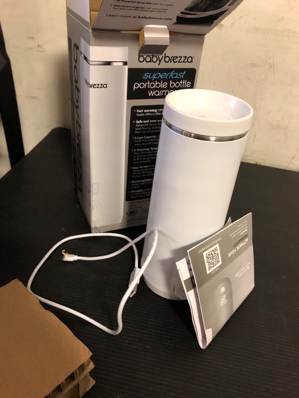 Photo 1 of Baby Brezza Superfast Portable Baby Bottle Warmer – 67% Faster - Travel Breastmilk Warmer and Formula Warmer - Safe, Even Heating - Up to 9oz - No Adapters, White